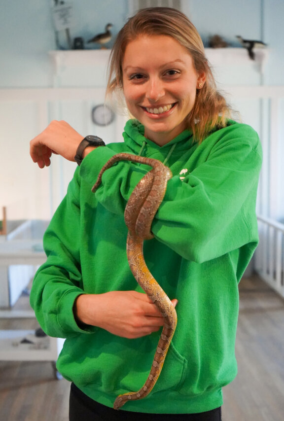 nhi staff holding snake